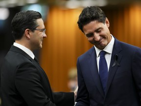Prime Minister Justin Trudeau and Conservative leader Pierre Poilievre greet each other as they gather in the House of Commons on Parliament Hill to pay tribute to Queen Elizabeth in Ottawa on Thursday, Sept. 15, 2022.