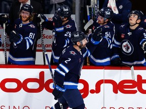 Jets defenceman Dylan DeMelo (2) celebrates his third period goal against the Vancouver Canucks at Canada Life Centre on Jan. 8, 2023.