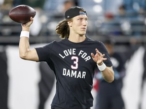 Quarterback Trevor Lawrence of the Jacksonville Jaguars warms up while wearing a shirt in support of Buffalo Bills safety Damar Hamlin prior to a game against the Tennessee Titans at TIAA Bank Field on January 07, 2023 in Jacksonville, Florida. Hamlin suffered cardiac arrest during the Bills' Monday Night Football game against the Cincinnati Bengals and remains in intensive care.