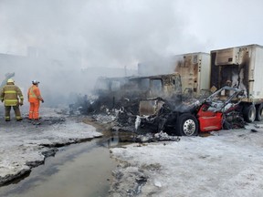 RCMP and firefighters respond to a fire on Friday, Jan. 20, 2023, at a business in the RM of Rosser just northwest of Winnipeg that is being investigated as an arson. The fire caused approximately $7 million in damage.