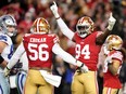 San Francisco 49ers defensive end Charles Omenihu (94) celebrates with San Francisco 49ers defensive end Samson Ebukam (56) after defeating the Dallas Cowboys 19-12 in a NFC divisional round game at Levi's Stadium in Santa Clara, Calif., on Jan 22, 2023.