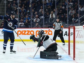 Winnipeg Jets forward Pierre-Luc Dubois (80) scores on Arizona Coyotes goalie Karel Vejmelka (70) during the second period at Canada Life Centre in Winnipeg on Sunday, Jan. 15, 2023.