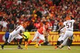 Kansas City Chiefs' Travis Kelce runs with the ball against the Cincinnati Bengals during the third quarter of the AFC Championship game at GEHA Field at Arrowhead Stadium.