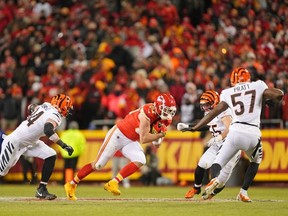 Kansas City Chiefs' Travis Kelce runs with the ball against the Cincinnati Bengals during the third quarter of the AFC Championship game at GEHA Field at Arrowhead Stadium.