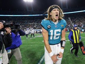 Jacksonville Jaguars quarterback Trevor Lawrence (16) celebrates after beating the Los Angeles Chargers during a wild card game at TIAA Bank Field in Jacksonville, Fla., on Saturday, Jan. 14, 2023.