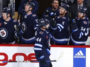 Winnipeg Jets defenceman Josh Morrissey (44) celebrates his third period goal against the Calgary Flames at Canada Life Centre. James Carey Lauder-USA TODAY Sports