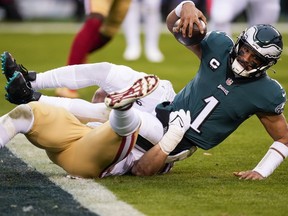 Philadelphia Eagles quarterback Jalen Hurts is sacked by San Francisco 49ers defensive end Nick Bosa during the first half of the NFC Championship NFL football game between the Philadelphia Eagles and the San Francisco 49ers on Sunday, Jan. 29, 2023, in Philadelphia.
