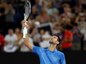 Serbia's Novak Djokovic celebrates winning his fourth round match against Australia's Alex De Minaur.