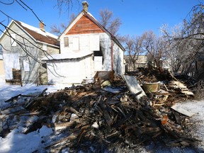 The remains of a vacant two-storey home on Stella Avenue which was demolished after a fire Saturday night in Winnipeg are pictured on Sunday, Jan. 22, 2023.