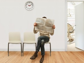 Person sitting in doctor office hospital waiting room clock long patient medical stock photo getty images