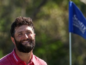 Jon Rahm of Spain smiles after making his putt for birdie on the 18th green during the final round of the Sentry Tournament of Champions at Plantation Course at Kapalua Golf Club on January 08, 2023 in Lahaina, Hawaii.