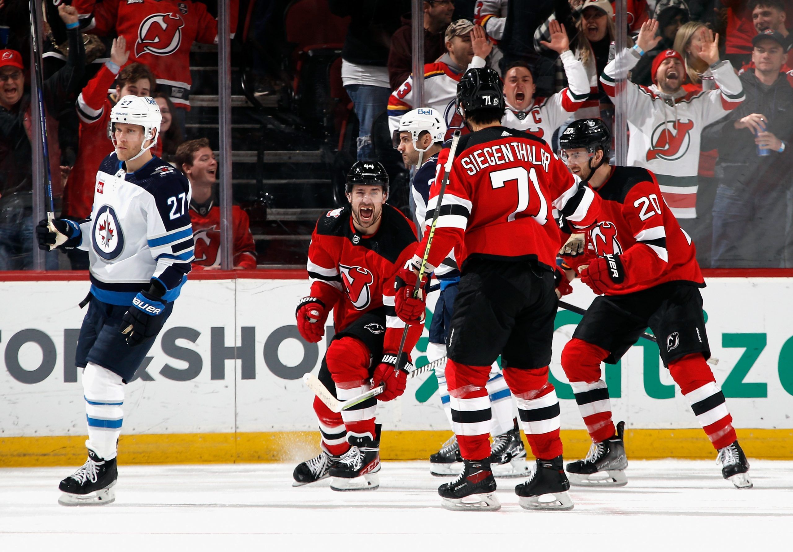 New Jersey Devils left wing Miles Wood (44) celebrates scoring a