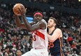 Raptors' Pascal Siakam takes in a rebound beside New York Knicks' Isaiah Hartenstein during the first half at Scotiabank Arena on Sunday, Jan. 22, 2023.