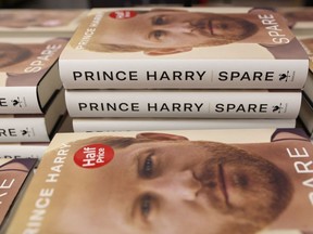 The book "Spare", by Britain's Prince Harry, Duke of Sussex, is displayed during a special midnight opening event for the release of the memoire at the WHSmith bookstore, at Victoria Station in London, on January 9, 2023. (Photo by ISABEL INFANTES/AFP via Getty Images)