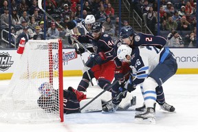 16 février 2023 ; Columbus, Ohio, États-Unis ; Le gardien de but des Blue Jackets de Columbus, Jonas Korbesalo (70 ans), couvre une rondelle lâche dans l'enclave contre les Jets de Winnipeg lors de la troisième période au Nationwide Arena. Crédit obligatoire : Russell LaBounty - USA TODAY Sports
