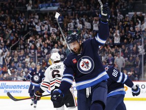 Winnipeg Jets right wing Blake Wheeler (26) celebrates his second period goal against the Chicago Blackhawks at Canada Life Centre in Winnipeg on Saturday, Feb. 11, 2023.