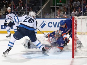 Jets forward Blake Wheeler is stopped by New York Islanders goalie Ilya Sorokin during the first period at the UBS Arena last night.