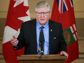 Scott Johnston, minister of seniors and long-term care, speaks at a press conference after he is sworn in at the Manitoba legislature in Winnipeg, Tuesday, Jan. 18, 2022. The Manitoba government is increasing funding for some programs that provide health and social support for seniors.