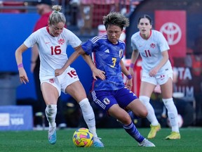 Canada forward Janine Beckie (16) and Japan defender Moeka Minami (3) chase the ball during the second half at Toyota Stadium on Feb. 22, 2023.
