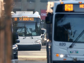 Transit buses on the road in Winnipeg on Wednesday, Jan. 4, 2023.
