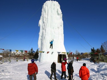 An ice climber takes to the 20-meter ice tower during Festiglace, an annual ice climbing festival in the St. Boniface area of Winnipeg on Sunday Feb. 5, 2023.