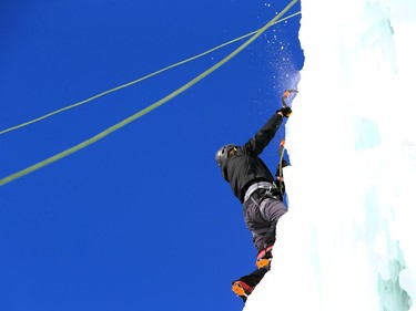 An ice climber tackles the 20-meter ice tower during Festiglace, an annual ice climbing festival in the St. Boniface area of Winnipeg on Sunday, Feb. 5, 2023.