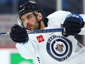 Defenceman Dylan DeMelo shoots during Winnipeg Jets practice on Monday, Feb. 13, 2023.
