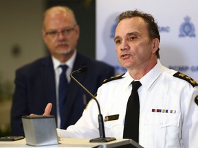 Police chief Danny Smyth (right) speaks with Justice minister Kelvin Goertzen looking on during a press conference at RCMP headquarters in Winnipeg on Tues., Feb. 21, 2023. KEVIN KING/Winnipeg Sun