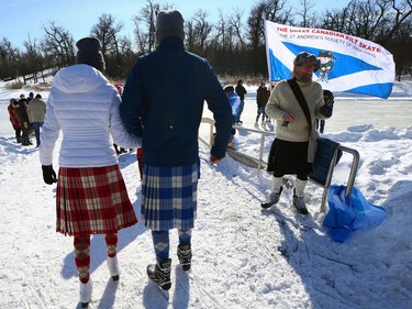 People wearing kilts head for the duck pond at Assiniboine Park for the Great Canadian Kilt Skate in Winnipeg on Sunday, Feb. 26, 2023.