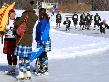 Members of Queen's Own Cameron Highlanders of Canada take part in the Great Canadian Kilt Skate at Assiniboine Park in Winnipeg on Sunday, Feb. 26, 2023.