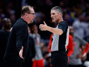 Toronto Raptors head coach Nick Nurse argues a call with referee Robert Hussey (85) in the fourth quarter against the Denver Nuggets.
