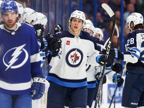 Morgan Barron (36) of the Winnipeg Jets celebrates his goal against the Tampa Bay Lightning during the second period of a hockey game at the Amalie Arena on Sunday, March 12, 2023 in Tampa, Fla.