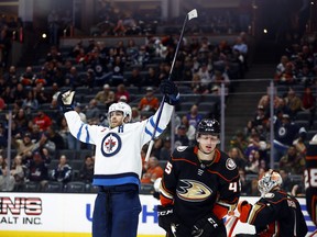 ANAHEIM, CALIFORNIA - MARCH 23:  Adam Lowry #17 of the Winnipeg Jets celebrates a goal against the Anaheim Ducks in the third period at Honda Center on March 23, 2023 in Anaheim, California. (Photo by Ronald Martinez/Getty Images)