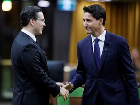 FILE PHOTO: Canada's Prime Minister Justin Trudeau and Conservative Party of Canada leader Pierre Poilievre greet each other in the House of Commons on Parliament Hill in Ottawa, Ontario, Canada on September 15, 2022.
