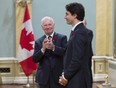 Governor General David Johnston applauds as he presents Prime Minister Justin Trudeau following his swearing-in during a ceremony at Rideau Hall, in Ottawa on Wednesday, Nov.4, 2015.