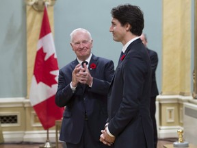 Governor General David Johnston applauds as he presents Prime Minister Justin Trudeau following his swearing-in during a ceremony at Rideau Hall, in Ottawa on Wednesday, Nov.4, 2015.