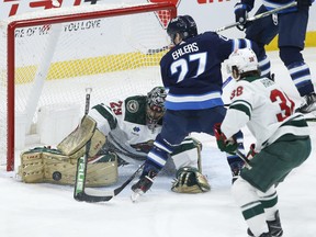 Jets’ Nikolaj Ehlers’ shot is stopped by the Wild’s Marc-Andre Fleury last night.