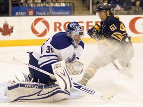 Toronto Maple Leafs goaltender Curtis Joseph makes a save on a shot by Buffalo Sabres right winger Maxim Afinogenov (61) during first period NHL action in Toronto on Thursday January 1, 2009.