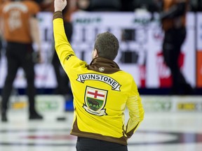 Manitoba's Matt Dunstone celebrates after booking a spot in the Tim Hortons Brier final on Sunday with a 7-5 win over Brendan Bottcher.