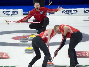 Team Canada skip Brad Gushue (top), lead Geoff Walker and second E.J. Harnden against Team Wild Card 3 yesterday.  Curling Canada /Michael Burns Photo
