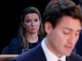 Prime Minister Justin Trudeau's chief of staff Katie Telford (left) listens as Trudeau speaks during the First Ministers meeting in Ottawa, Dec. 9, 2016.