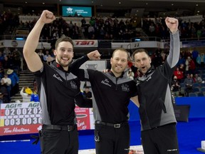 Brad Gushue (right), won the 2022 Brier with only three players available for the final weekend, including Brett Gallant (left) and Geoff Walker.