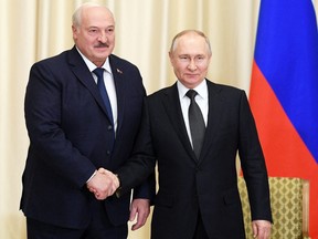 Russian President Vladimir Putin shakes hands with Belarusian President Alexander Lukashenko during a meeting at the Novo-Ogaryovo state residence outside Moscow, Russia Feb. 17, 2023.