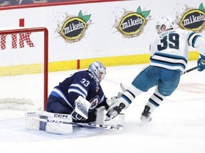 San Jose Sharks centre Logan Couture scores on Winnipeg Jets goaltender David Rittich in overtime at Canada Life Centre. James Carey Lauder/USA TODAY SPORTS