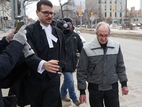 Retired priest Arthur Masse, 93, leaves the Law Courts in Winnipeg, Thursday, March 30, 2023, after a judge acquitted him of indecent assaut.
