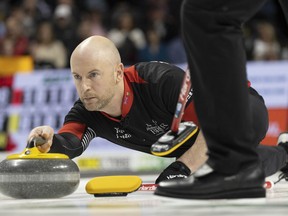 Team Ontario third, Ryan Fry makes a shot against Team Canada during the Tim Hortons Brier at Budweiser Gardens in London, Ont. on Saturday, March 4, 2023. The decorated Canadian curler has indicated on his social media accounts he's stepping back from competitive curling.