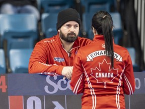 Reid Carruthers (left), worked as the coach for Kerri Einarson's Team Canada as it won a fourth straight Scotties Tournament of Hearts title on Sunday.