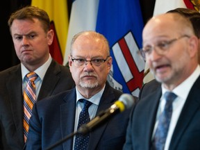 Manitoba Justice Minister Kelvin Goertzen, centre, looks on as Justice Minister David Lametti speaks during a Federal-Provincial-Territorial Ministers meeting on bail reform in Ottawa, on Friday, March 10, 2023. Municipal councillors and school board trustees in Manitoba may soon face new rules if they want to make the jump to provincial politics.