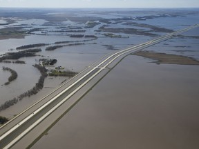 Some sections of Highway 75 south to the United States are closed as a result of Red River flooding south of Winnipeg, Sunday, May 15, 2022. The Manitoba government is expecting flooding along the Red River south of Winnipeg this year, although not enough to overcome community dikes and diversions.
