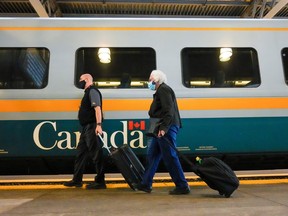 Via Rail passengers disembark at Union Station in Toronto on Oct. 6, 2021.